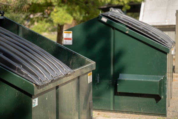 commercial dumpsters have restrictions on hazardous materials and certain other items, so it's important to check with your provider